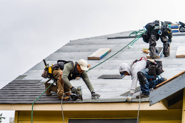 Professional Roofing technician working in Bayport, NY